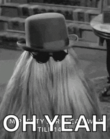 a black and white photo of a person wearing a top hat and saying oh yeah till 14