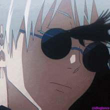 a close up of a person wearing sunglasses with the idlegiance watermark
