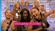a group of women standing next to each other with the words " we 're going on a hike "