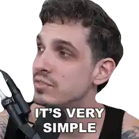 a man holding a microphone with the words it 's very simple written on his face