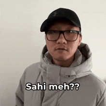 a man wearing glasses and a hat says sahi meh?
