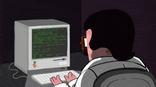 a man is typing on a keyboard in front of a computer monitor that says ' kernel ' on the screen