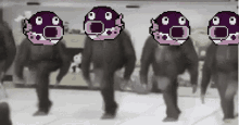 a group of people are walking in a line with purple faces on their heads