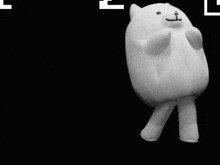 a stuffed animal with a face drawn on it is laying down