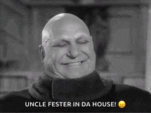 a bald man is smiling with the words uncle fester in da house