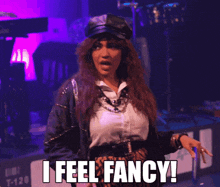 a woman says i feel fancy in front of a stage