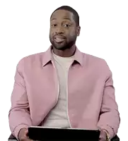 a man in a pink jacket is holding a tablet and smiling