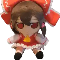 a stuffed doll wearing a red and white outfit and a red hat