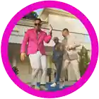 three men in suits are dancing in front of a large house