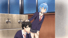 a girl with blue hair is petting the head of a boy