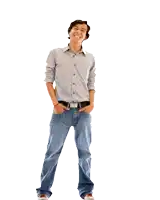 a man standing with his hands in his pockets and a smile on his face