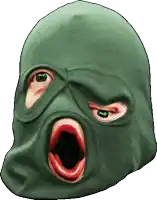 a green mask with a red mouth and eyes