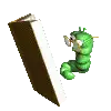 a green caterpillar is reading a book next to an open book .