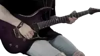 a person is playing a purple electric guitar with the letter k on the neck