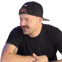 a man wearing a black t-shirt and a hat with the word asics on it