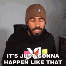 a man with a beard is wearing a beanie and a hoodie that says it 's just gonna happen like that