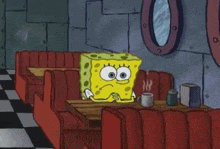 a cartoon of spongebob squarepants sitting at a table in a diner