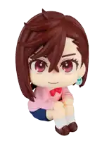 a figurine of a girl with brown hair is sitting on a white background