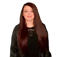 a woman with long red hair is wearing a black sweater with the letter t on it