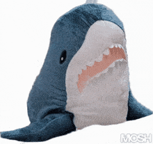 a stuffed shark with its mouth open and the word mosh written below it