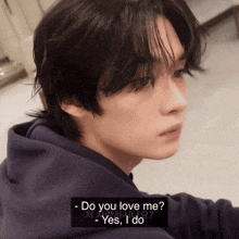 a close up of a person 's face with the words " do you love me " in the corner