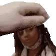 a person is putting a towel on the head of a woman .