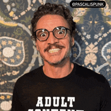 a man wearing glasses and a shirt that says adult