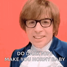 a man wearing glasses is smiling and saying do dark nips make you horny baby .