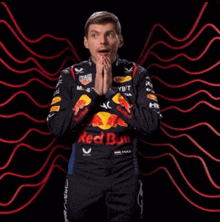 a man wearing a tag heuer jacket with red bull on it