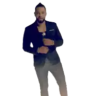 a man with a ponytail and a beard is standing in front of a white background