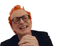 a man with red hair and glasses is laughing with his mouth open