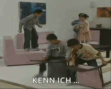 a group of children are playing with a table in a living room with the words kenn ich written on the bottom .