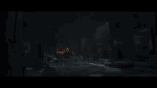 a man in a red cape is sitting with his arms outstretched in a dark room