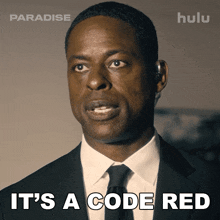 a man in a suit and tie with the words it 's a code red