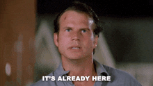 a man says " it 's already here " in front of a dark background