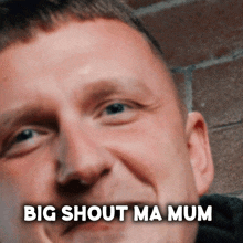 a close up of a man 's face with the words " big shout ma mum " below it